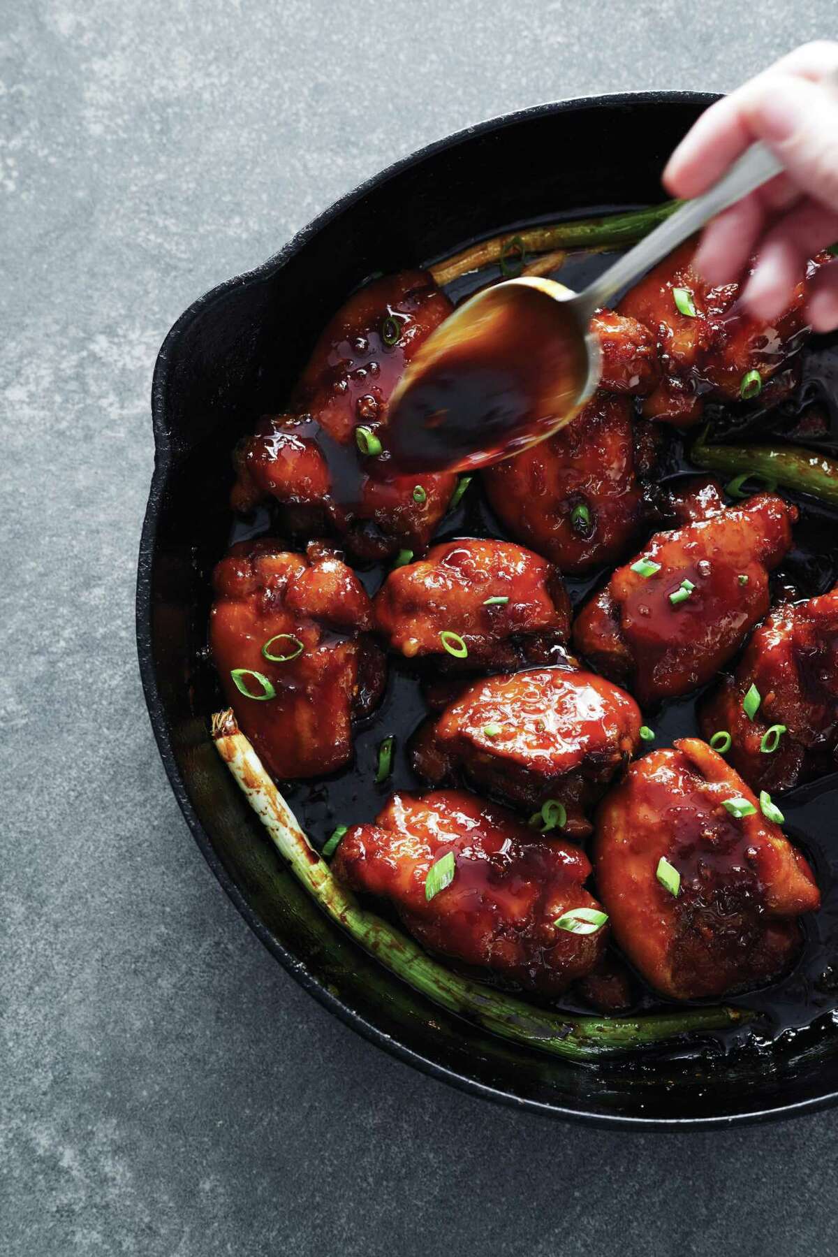 Sticky Chicken Thighs with Ginger and Garlic from "Skillet Love," a cookbook on cast-iron pan cooking by Ann Byrn.