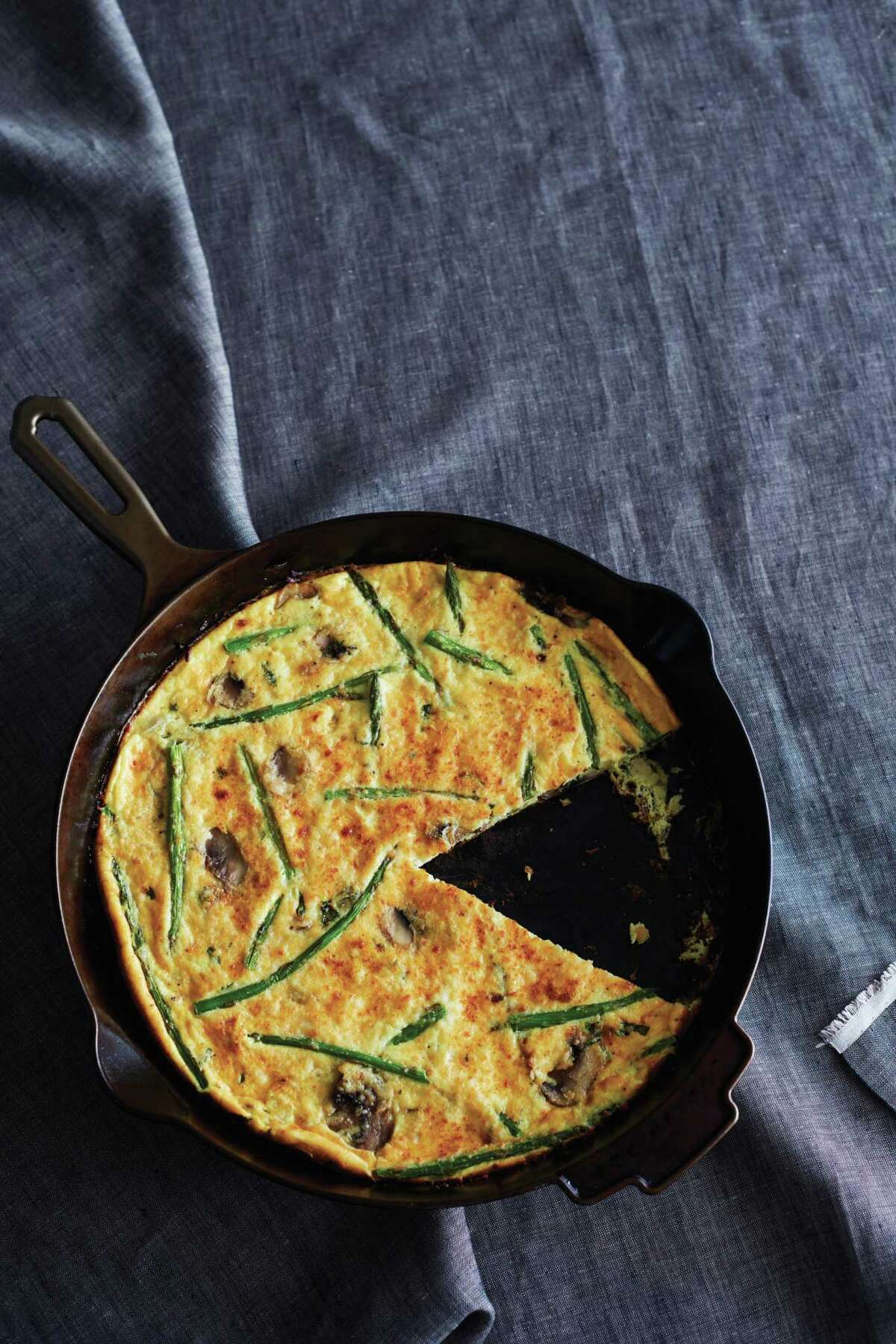 Fresh Asparagus Frittata appears in“Skillet Love,” a cookbook on cast-iron pan cooking by Ann Byrn. This recipe and more, page D8