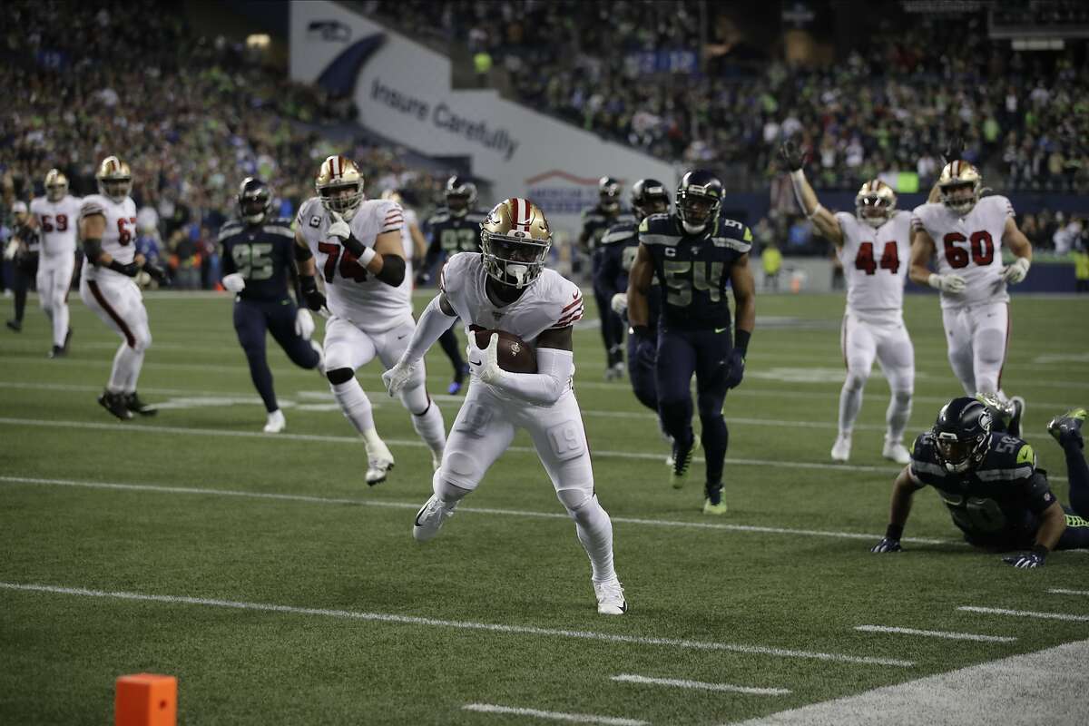 San Francisco 49ers wide receiver Deebo Samuel scores on a 30-yard run against the Seattle Seahawks during the first half of an NFL football game, Sunday, Dec. 29, 2019, in Seattle. (AP Photo/Stephen Brashear)