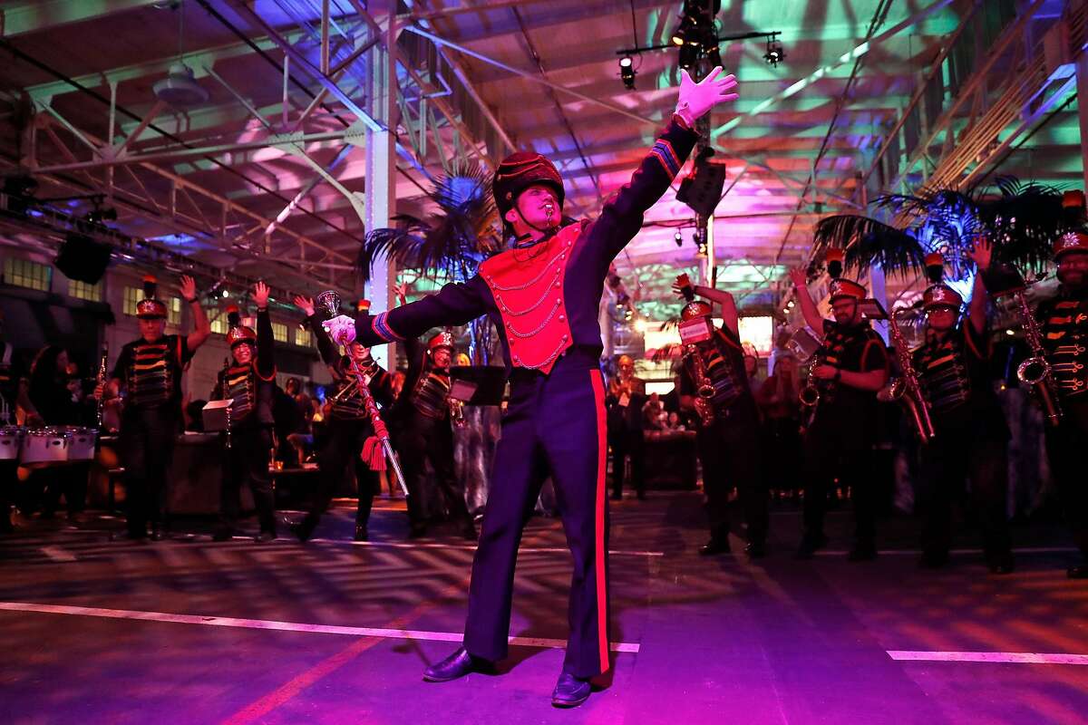 Michael Wong, Artistic Director of the Marching & Pep Bands for the San Francisco Lesbian/Gay Freedom Band, performs with the band during PCMA Convening Leaders 2020 party at Pier 48 in San Francisco, Calif., on Sunday, January 4, 2020.