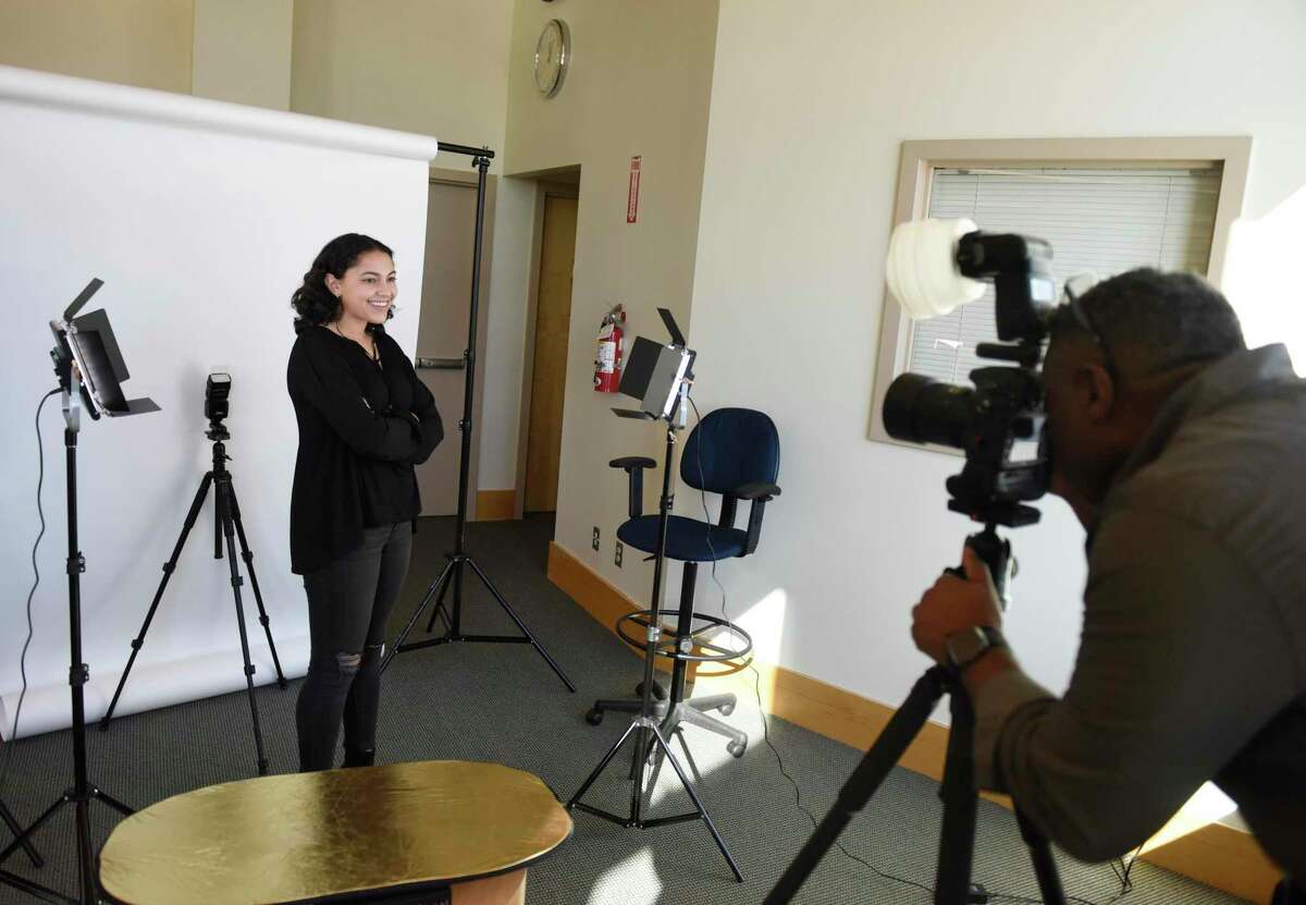 Barnard College junior Olivia Aly, a Greenwich High School graduate, gets headshots taken by photographer Asher Almonacy during the "Kickstart Your Job or Internship Search" event at Greenwich Library's Flinn Gallery in Greenwich, Conn. Monday, Jan. 6, 2020. College students home during winter break learned valuable tips to make themselves more hireable, including resume writing, creating a LinkedIn page, interview advice, networking skills, and were given professional headshots.