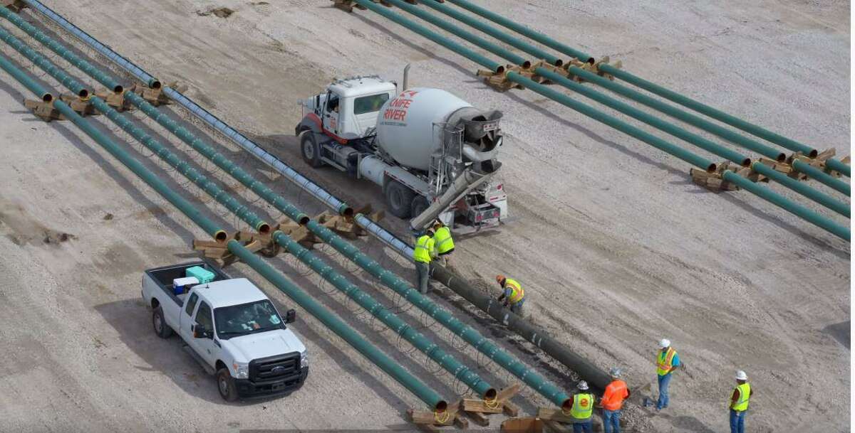 Contractors work on the initial stage of construction at the future Port Arthur LNG export facility in the Sabine Pass community of Port Arthur in early December. Port Arthur LNG is a proposed venture by Sempra LNG and Saudi Aramco.