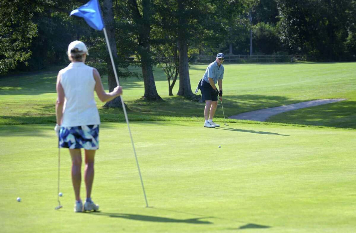 Connie Bennett and Bill Wilson play a round of golf Wednesday, August 22, 2018, at Oak Hills Park Golf Course in Norwalk, Conn. Oak Hills Park Golf Course is well into the 2018 golfing season after receiving $1.5 million in improvements to the 18-hole municipal golf course off Fillow Street in West Norwalk.