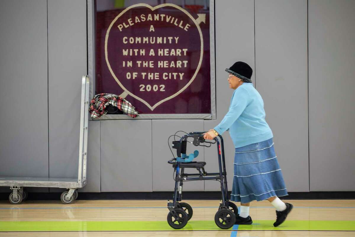 Essie Long walks for exercise inside they gymnasium at the J. Robinson, Sr., Community Center in the Pleasantville neighborhood of Houston, Tuesday, Dec. 17, 2019. Long's parents moved into the neighborhood in the 1950s when she was a teenager. Long moved back to the neighborhood in 1985 and has lived there since. Since its founding, the historic Pleasantville neighborhood on Houston's east side, has seen heavy industry displace residential areas and slowly surround the neighborhood's borders. Achieving Community Tasks Successfully, or ACTS, a community-based organization in the historic Pleasantville neighborhood, is partnering with several organizations, including the Environmental Defense Fund and universities like Texas Southern University, to establish its own community-owned air monitoring network. The solar-powered monitors are calibrated to nearby federal regulatory monitors and designed to detect a range of airborne toxins, including fine particles, nitrogen oxide and volatile organic compounds, all of which are harmful to human health.