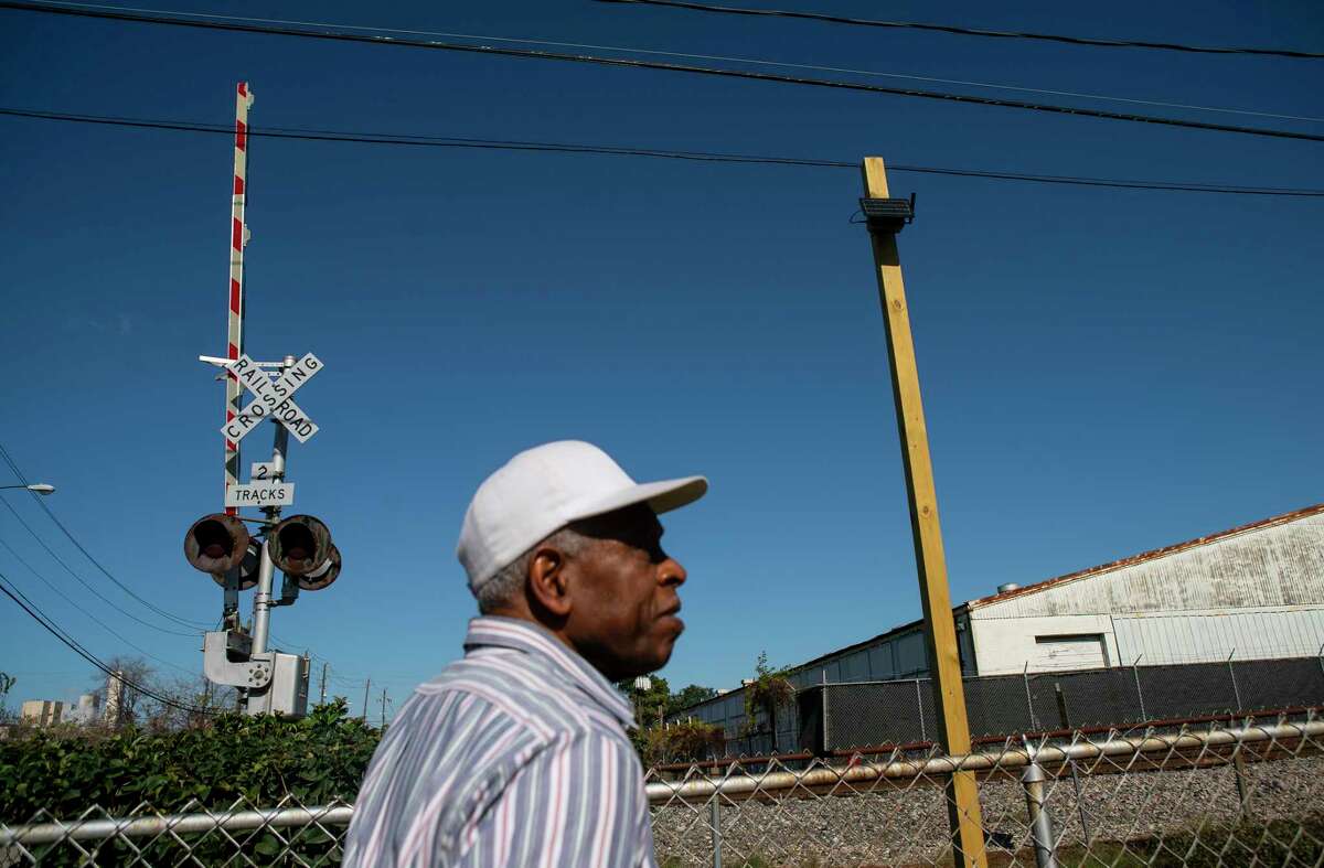 Cleophus Sharp, who first moved to the Pleasantville neighborhood in 1951, looks at one of the solar-powered air monitors he helped install at one of the entrances to the historic east side community in Houston, Tuesday, Dec. 17, 2019. Since its founding, the historic Pleasantville neighborhood on Houston's east side, has seen heavy industry displace residential areas and slowly surround the neighborhood's borders. Achieving Community Tasks Successfully, or ACTS, a community-based organization in the historic Pleasantville neighborhood, is partnering with several organizations, including the Environmental Defense Fund and universities like Texas Southern University, to establish its own community-owned air monitoring network. The solar-powered monitors are calibrated to nearby federal regulatory monitors and designed to detect a range of airborne toxins, including fine particles, nitrogen oxide and volatile organic compounds, all of which are harmful to human health.