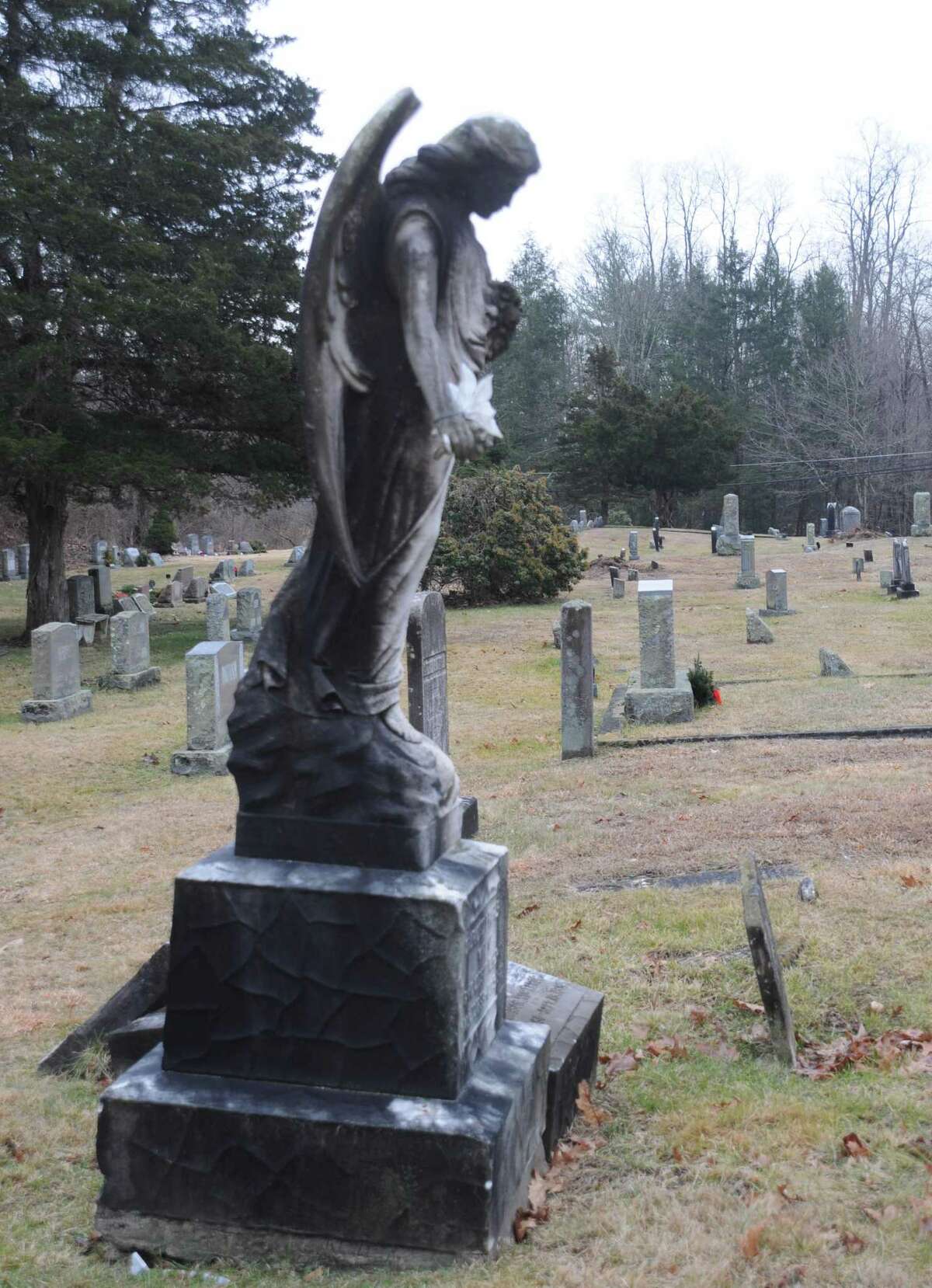 Old stones and statues mark the graves at Branchville Cemetery. The town is working to gain title to the graveyard, which dates to the mid 1800s.