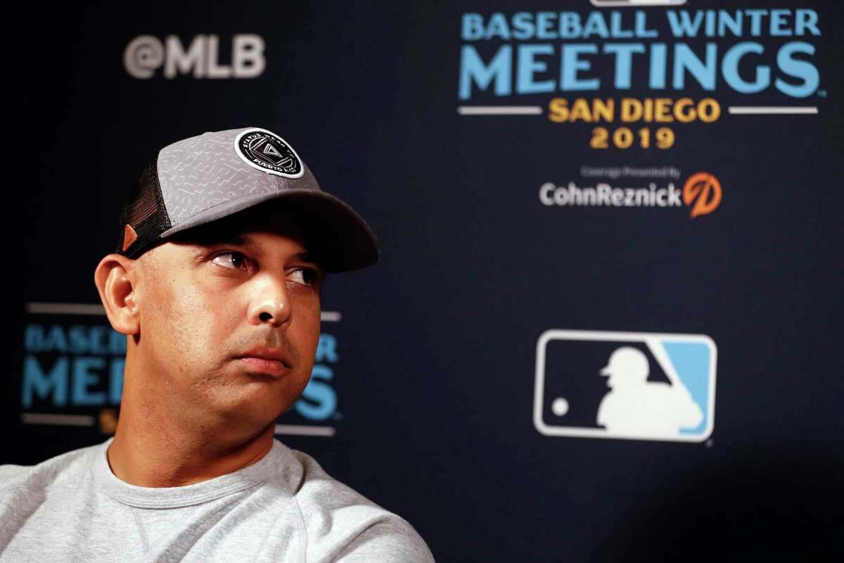 Manager Alex Cora of the Boston Red Sox looks on from the dugout