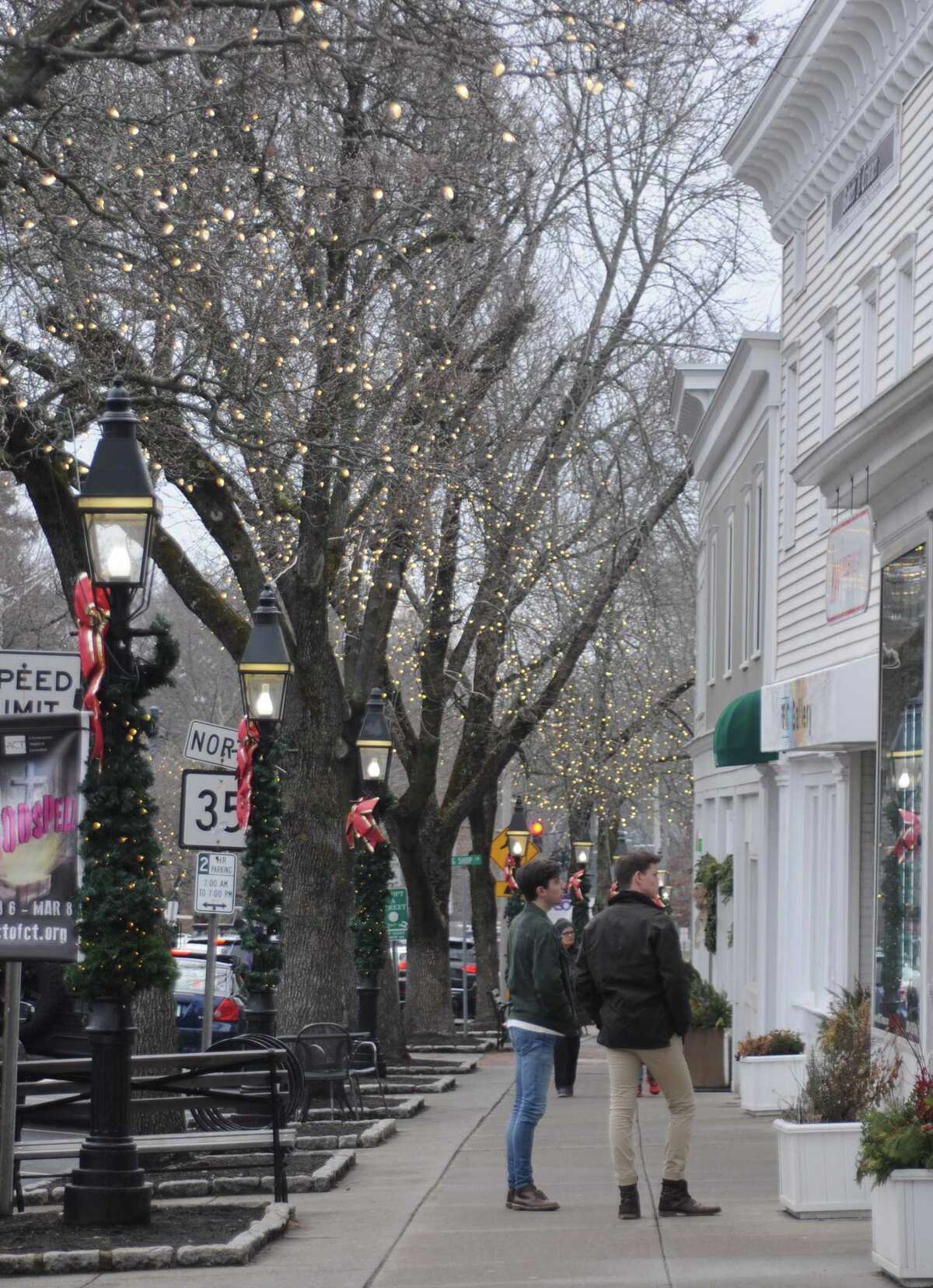 Prospective shoppers stroll Ridgefield's Main Street on Friday, Jan. 3.