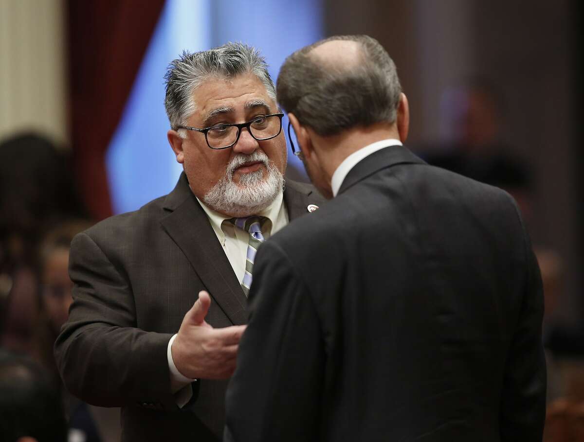 State Sen. Anthony Portantino, D-La Canada Flintridge, left, talks with Sen. Jerry Hill, D-San Mateo, right, during the Senate session at the Capitol Thursday, May 16, 2019, in Sacramento, Calif. Portantino is chairman of the Senate Appropriations Committee, which blocked a measure by Sen. Hannah-Beth Jackson, D-Santa Barbara, before his committee to expand the state's new data privacy law and allow consumers to take companies to court over violations Thursday. (AP Photo/Rich Pedroncelli)