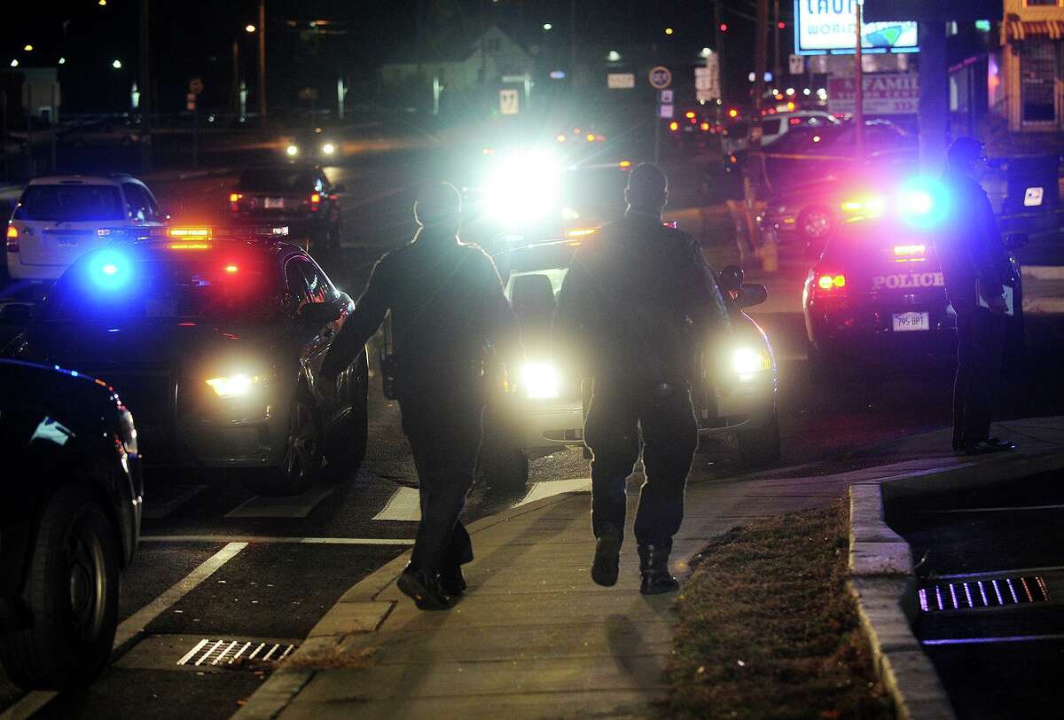 Police cars block off access to Bayview Plaza on Boston Avenue in Bridgeport, Conn. where Carnell Williams was shot and killed November 25, 2013.