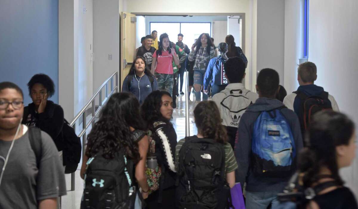 Students fill the hallway of the new addition at Danbury High School between classes on Wednesday, October 10, 2018, in Danbury, Conn.