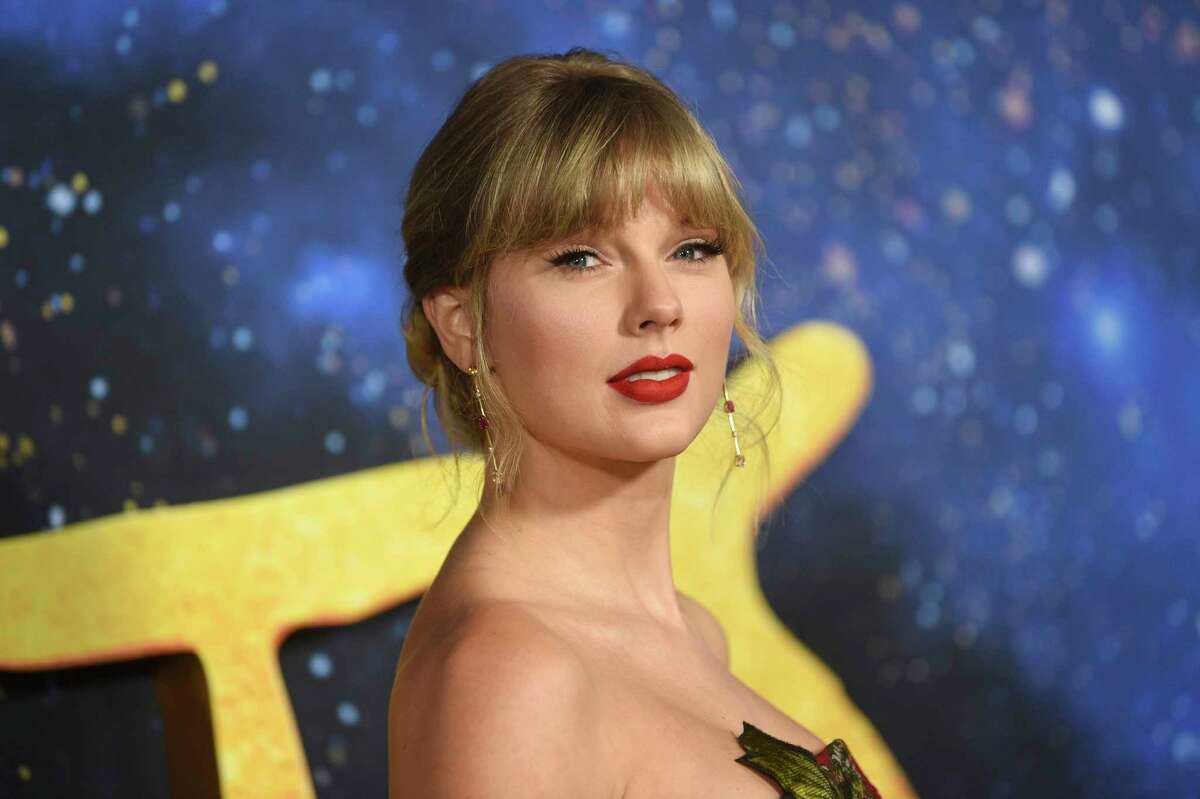 FILE - In a Monday, Dec. 16, 2019 file photo, Taylor Swift attends the world premiere of "Cats," at Alice Tully Hall, in New York. Taylor Swift and writer-director-producer Janet Mock will be honored at the GLAAD Media Awards for their advocacy for LGBTQ issues. Swift has been an outspoken proponent of the Equality Act and her video for her hit aYou Need To Calm Downa featured prominent LGBTQ celebrities. The pop star will get the Vanguard Award during the ceremony in Los Angeles in April 2020. Mock writes and directs on the FX series aPose.a She will receive the Stephen F. Kolzak Award, presented to a LGBTQ media professional.(Photo by Evan Agostini/Invision/AP, File)