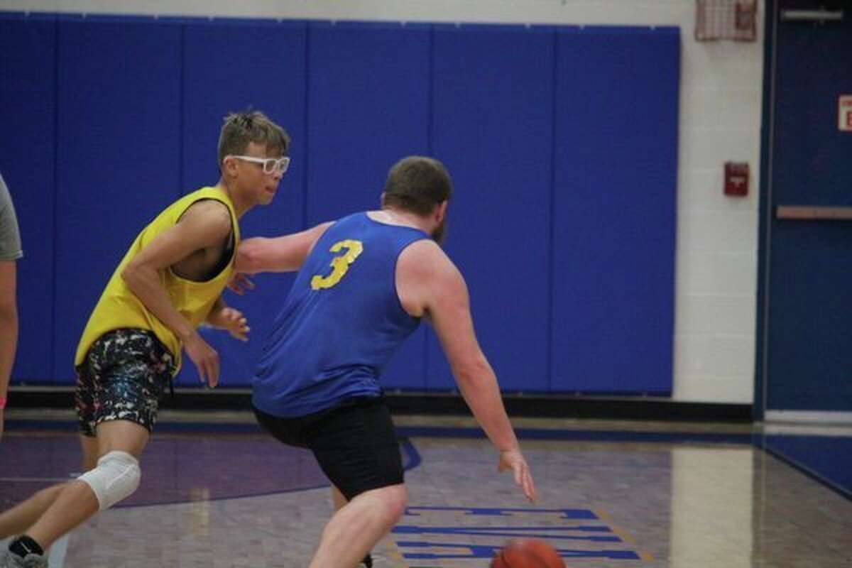 Evart's Justin Buckner (3) drives against Baldwin's Aveon Hobbs in Friday's scrimmage. (Herald Review photo/John Raffel)