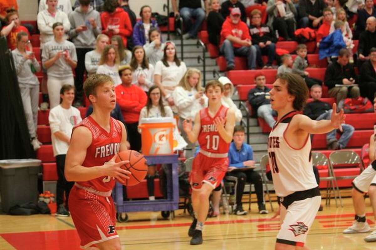 Reed City's Jason Thomas (right) applies the defensive pressure against Fremont earlier this season. (Herald Review photo/John Raffel)