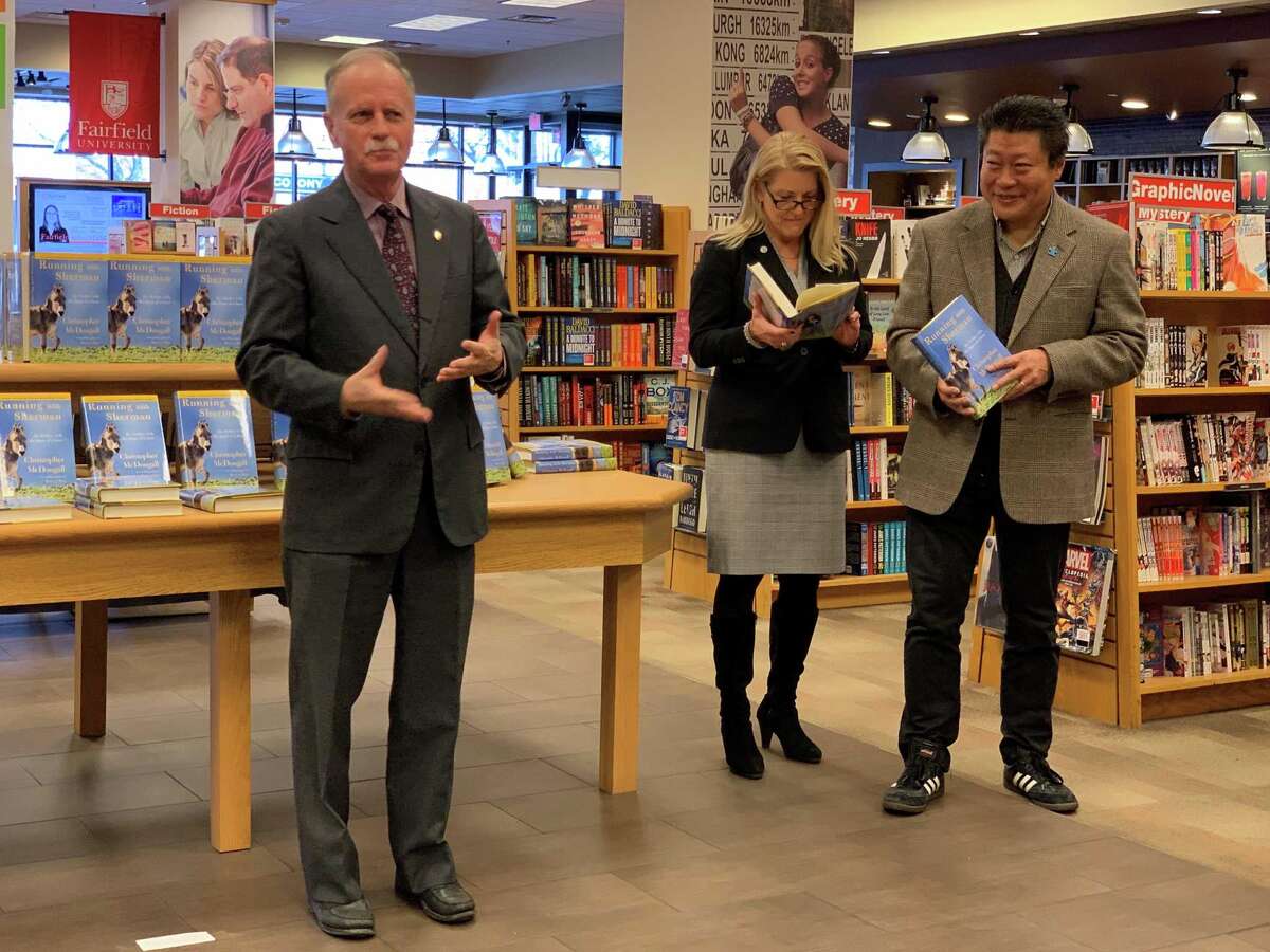 James Fitzpatrick, left, assistant vice president at Fairfield University, with First Selectwoman Brenda Kupchick and State Senator Tony Hwang at the One Book One Town event Tuesday.