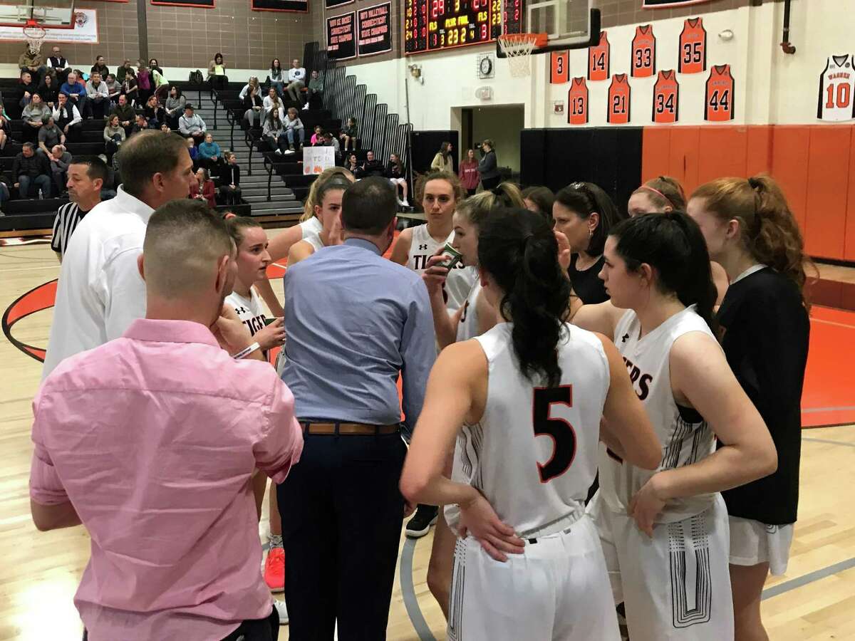 Ridgefield coach Rob Coloney talks to his players during Tuesday night's game against Stamford.
