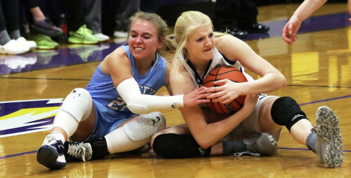 Jersey’s Clare Breden (left) and CM’s Claire Christeson battle for a loose ball in the second half Tuesday night in Bethalto. CM was granted a timeout on the play.