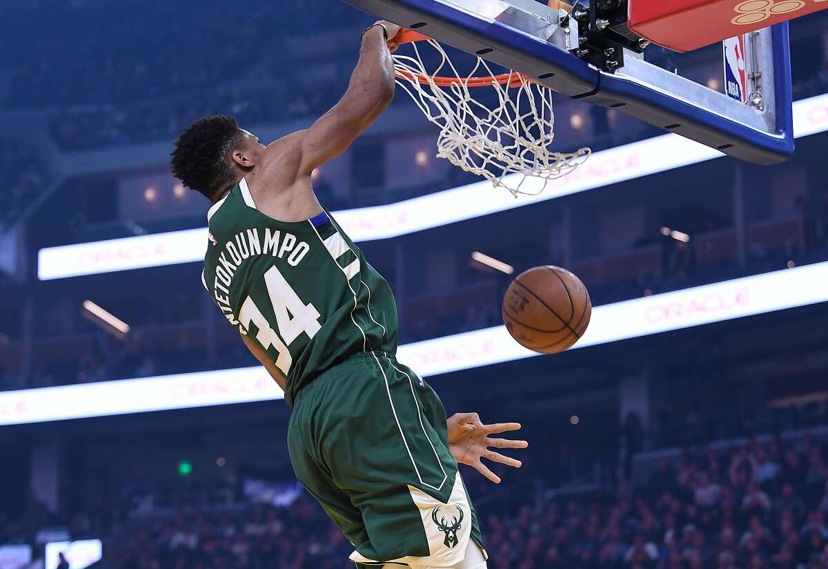 Giannis Antetokounmpo #34 of the Milwaukee Bucks slam dunks against the Golden State Warriors during the first half of an NBA basketball game at Chase Center on January 08, 2020 in San Francisco, California.