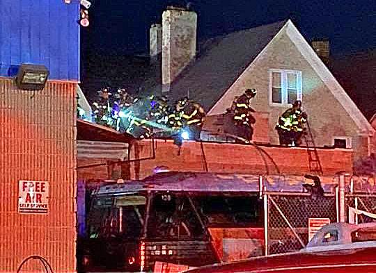 Firefighters extinguish roof fire at New Haven auto repair garage