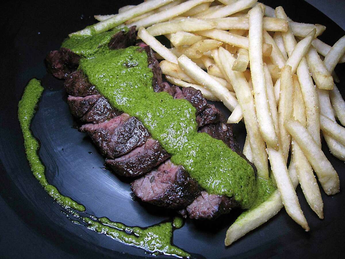 Steak frites comes with chimichurri sauce at Julia's Bistro & Bar.