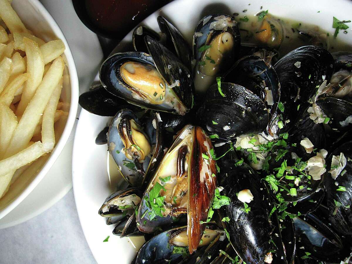 Moules frites are mussels in white wine cream sauce with french fries at Julia's Bistro & Bar.