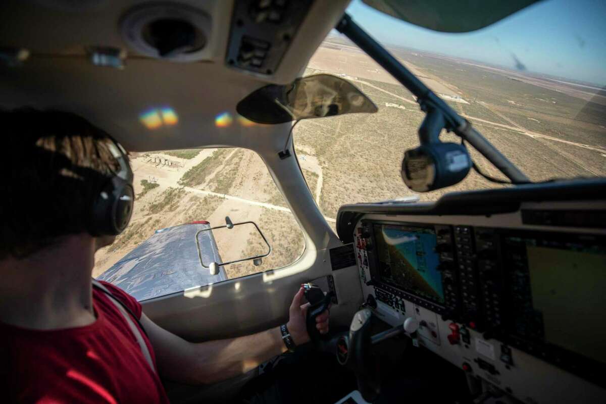 Paolo Wilczak, a scientist and the pilot of the two-seater aircraft, circles above the Permian Basin in Texas, searching for methane leaks, Nov. 4, 2019. Immense amounts of methane are escaping from oil and gas sites nationwide, worsening global warming, even as the Trump administration weakens restrictions on offenders. (Jonah M. Kessel/The New York Times)