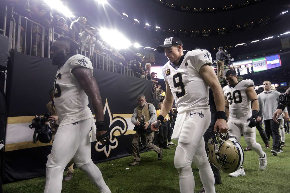 New Orleans Saints quarterback Drew Brees (9) walks off the field after their overtime loss to the Minnesota Vikings in an NFL wild-card playoff football game, Sunday, Jan. 5, 2020, in New Orleans. The Vikings won 26-20. (AP Photo/Brett Duke)
