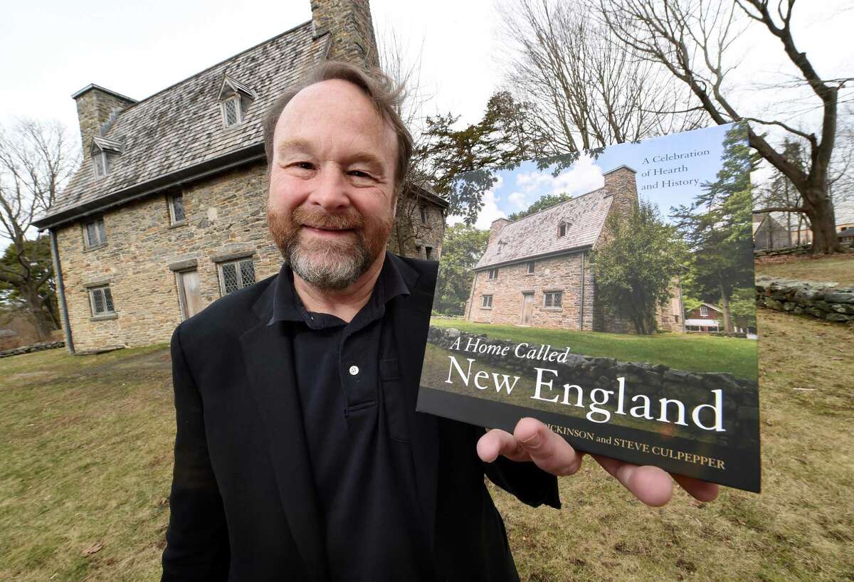 DUO’S TALE: Architect Duo Dickinson, shown in 2018 with a book he co-authored on New England, will present the Frederick Lee lecture on “The Riveting Tale of the Protestant Outcasts Who Settled New England and Built Strong Communities of Faith, Industry, and Innovation” at 4 p.m. Sunday, Jan. 12, in Hubley Hall at the Franklin A. Bower Church House, The First Congregational Church of Madison, on the Green. Admission is $5 adults, less for members and children.