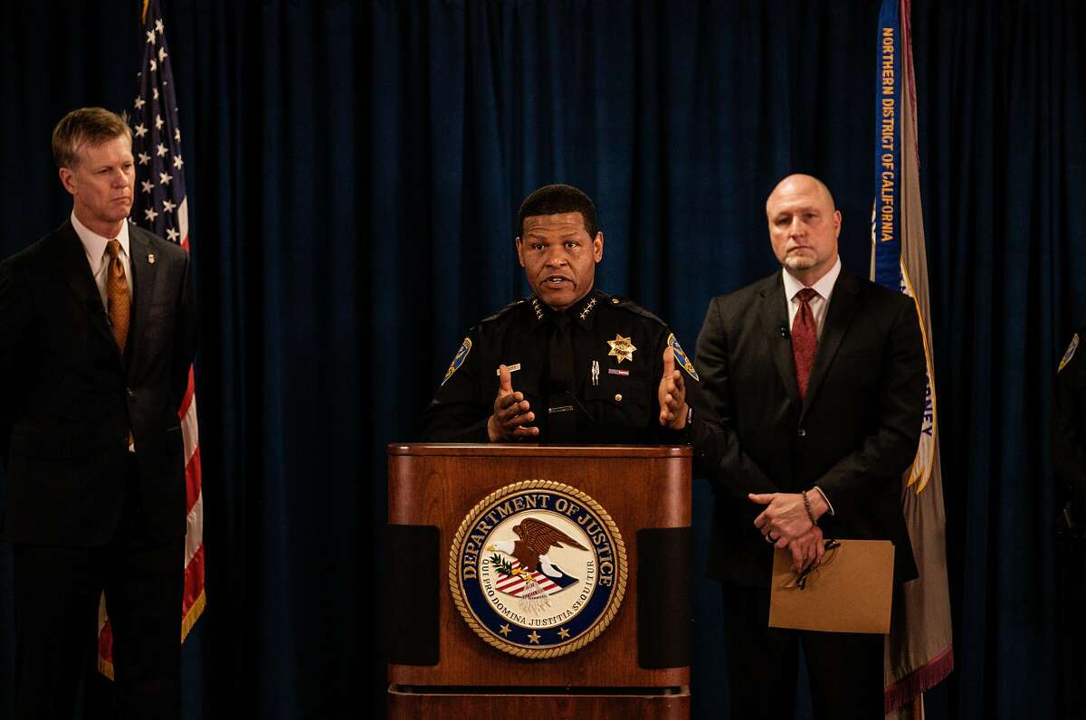 San Francisco Police chief William Scott, center speaks at a press conference in San Francisco, Calif. on Thursday, January 9, 2020. He was flanked by U.S. Attorney David Anderson, left, and John F. Bennett, special agent in charge of the FBI's San Francisco field office. During the press conference it was revealed that two alleged gang members were charged with multiple counts of using a firearm in a violent crime resulting in death and ex-felons being in possession of a firearm. Because of gang enhancements, the men could face the death penalty if convicted.