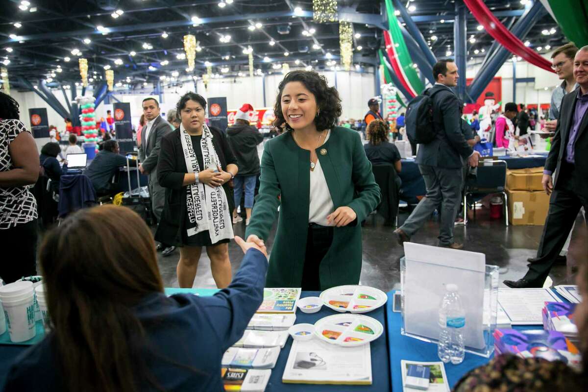 Judge Lina Hidalgo greets tables of volunteers during the 25th annual Toys for Kids event hosted by Congresswoman Sheila Jackson-Lee at the George R. Brown Convention Center in downtown Houston on Saturday, Dec. 14, 2019, in Houston.