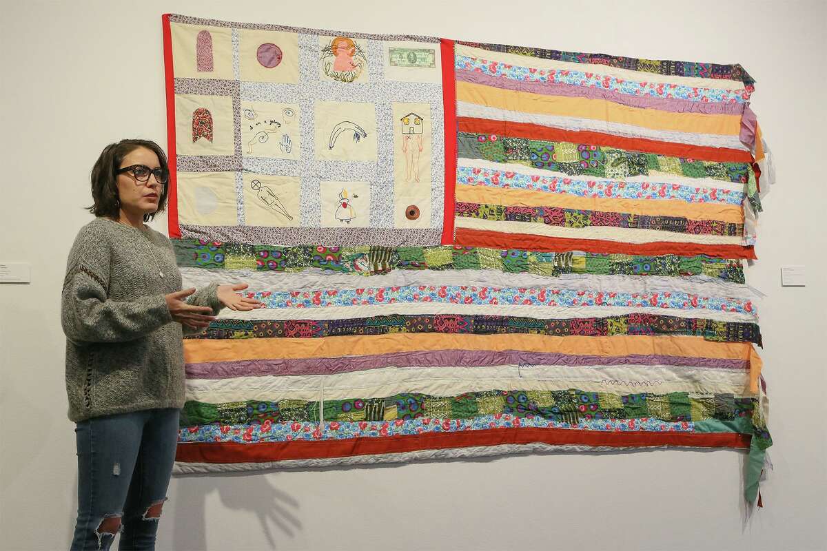 Visual aritst Jenell Esparza, shown with her hand-sewn quilt “Continent” for an exhibit at Artpace, has received a $5,000 grant from the Luminaria Artist Foundation.