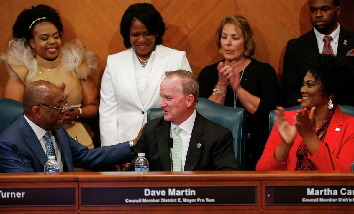 Mayor Sylvester Turner congratulates Dave Martin, Council Member District E, after being named Mayor Pro Term during the council meeting at City Hall Thursday, Jan. 2, 2020, in Houston.