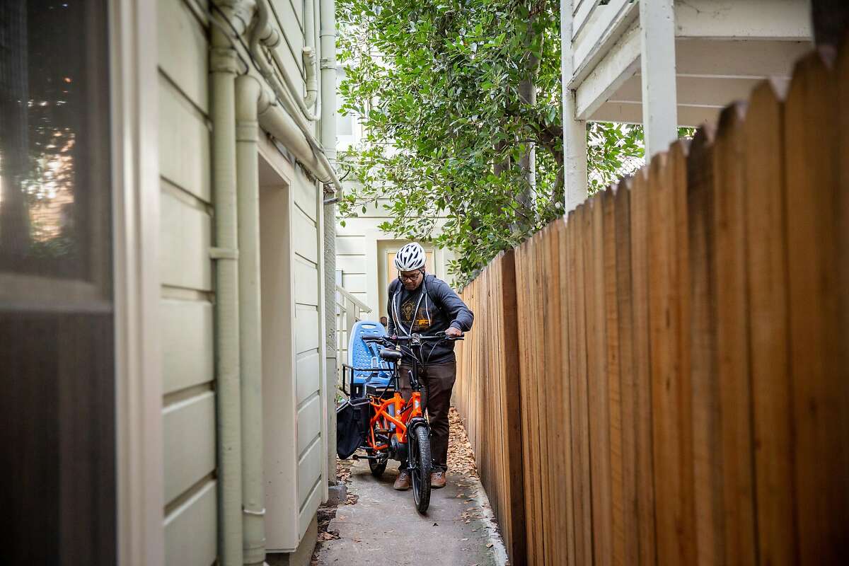 Ed Parillon takes out his bike from his home, Friday, Jan. 3, 2020, in San Francisco, Calif. Parillon runs errands and uses a bike instead of a car.