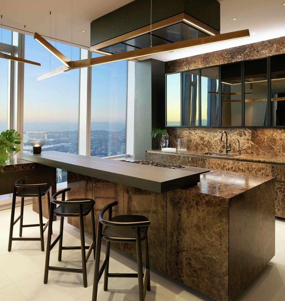 <p>Limestone flooring, with Rossana custom kitchen cabinets and counter seating, Gaggenau appliances including refrigerator and freezer tower, double ovens, wine tower, dishwasher, five-burner cooktop, grill, and</p>