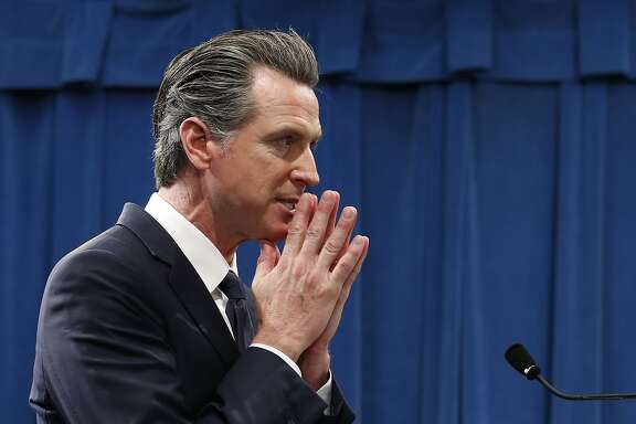 California Gov. Gavin Newsom listens to a question concerning his proposed 2020-2021 state budget during a news conference in Sacramento, Calif., Friday, Jan. 10, 2020.