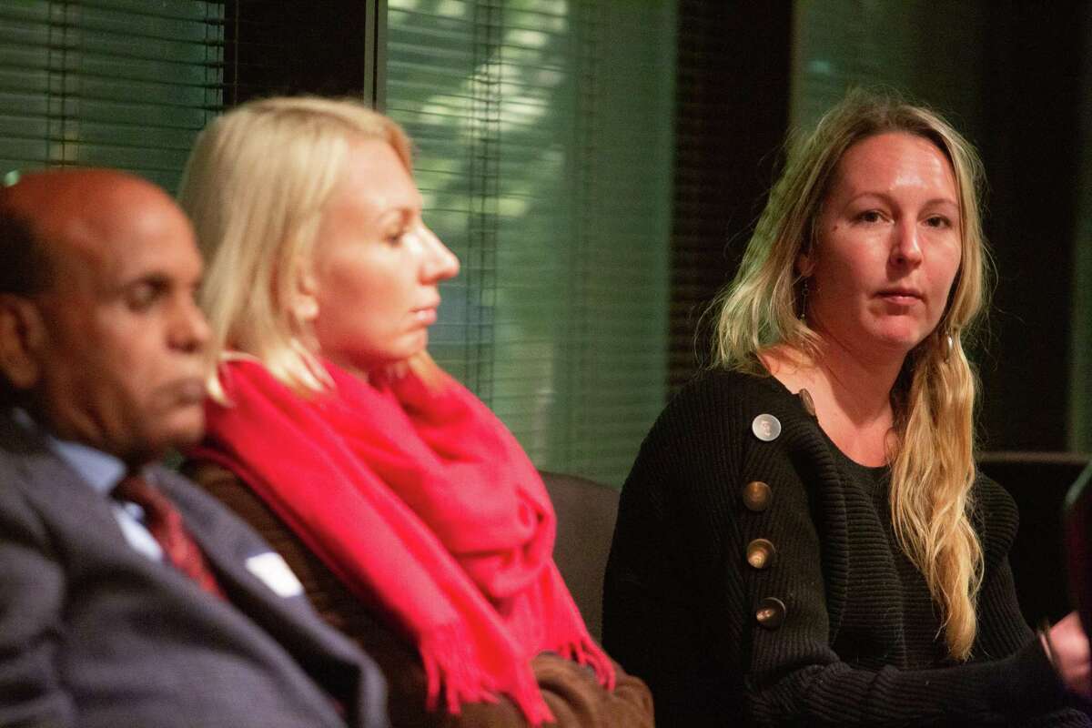 Houston Chronicle reporter Lomi Kriel talks during a roundtable discussion at Interfaith Ministries in Houston, Nov. 12, 2019. At left are, Geleta Mekonnen and Elena Korbut.