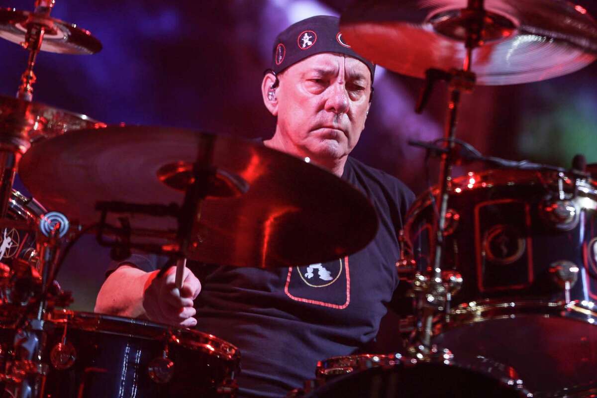 FILE - This Aug. 1, 2015 file photo shows Neil Peart of Rush performing during the final show of the R40 Tour in Los Angeles. Peart, the renowned drummer and lyricist from the band Rush, has died. His rep Elliot Mintz said in a statement Friday that he died at his home Tuesday, Jan. 7, 2020 in Santa Monica, Calif. He was 67. (Photo by Rich Fury/Invision/AP, File)