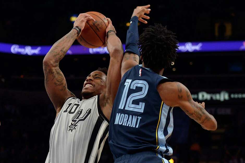 DeMar DeRozan battles Grizzlies point guard Ja Morant. DeRozan had a game-high 36 points for the Spurs, while Morant had 22 points and 14 assists.