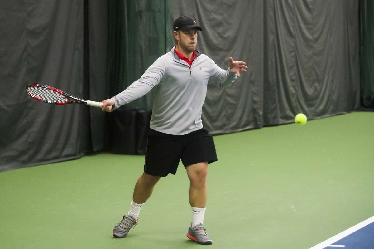 File - Mike Rose of Midland returns the ball while competing in the World Team Tennis Tournament Saturday, Jan. 11, 2020 at the Greater Midland Tennis Center. (Katy Kildee/kkildee@mdn.net)