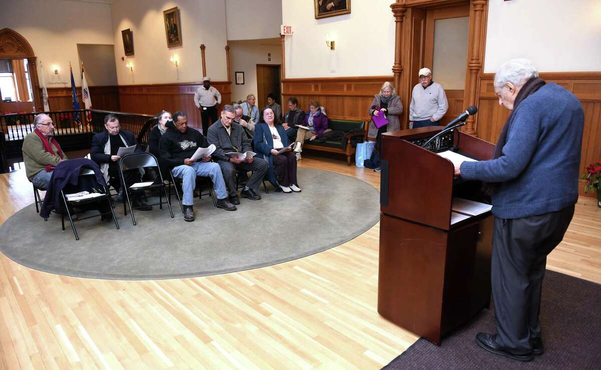 In an event sponsored by the Greater New Haven Peace Council, Al Marder (right) begins the public reading of Martin Luther King, Jr.'s, speech, Beyond Vietnam, at City Hall in New Haven on January 15, 2019.