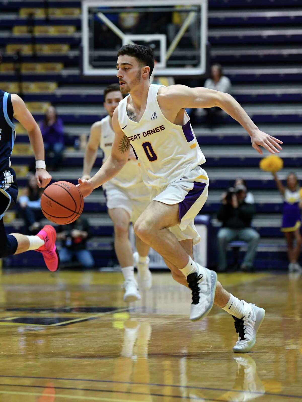 University at Albany guard Antonio Rizzuto (0) moves the ball against Maine during the first half of an NCAA basketball game Saturday Jan. 11, 2020, in Albany, N.Y.