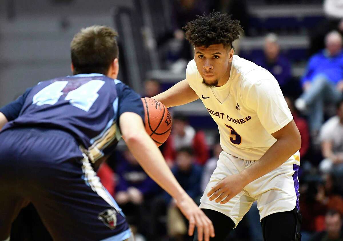 Maine guard Peter Stumer (44) defends against University at Albany guard JoJo Anderson (3) during the first half of an NCAA basketball game Saturday Jan. 11, 2020, in Albany, N.Y.