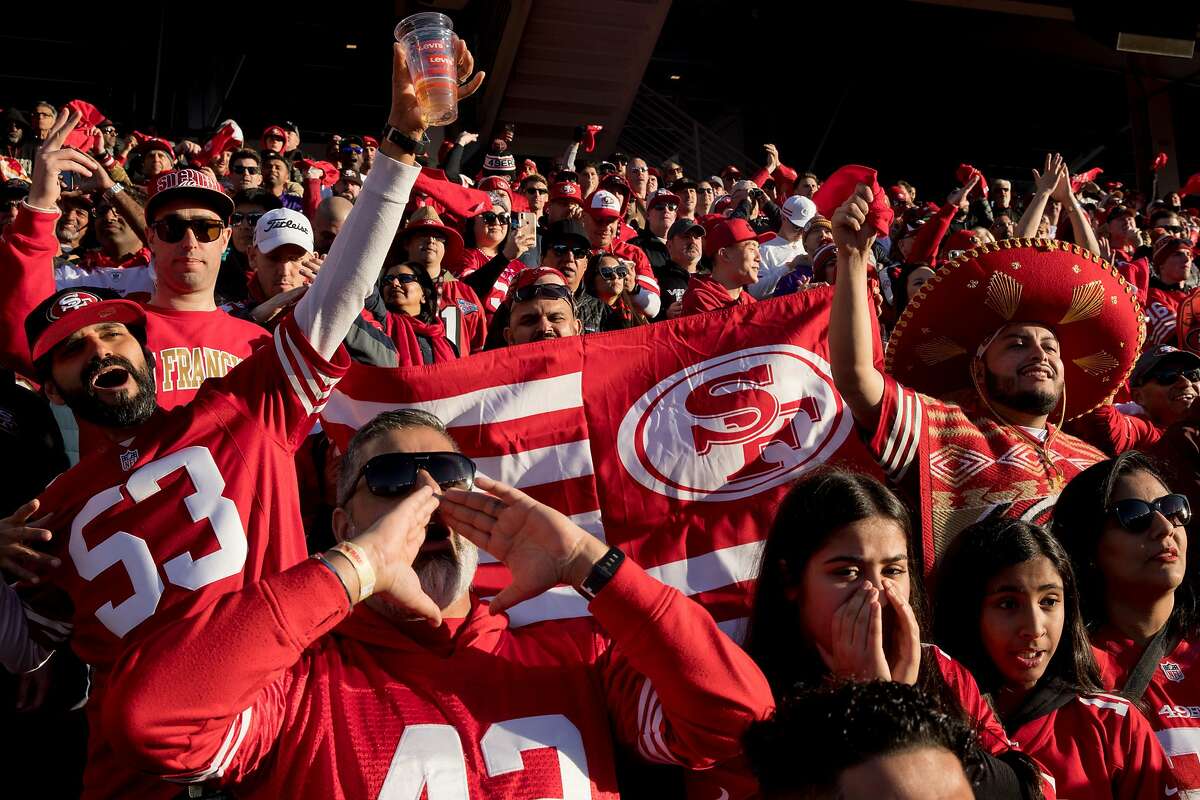 CQ** San Francisco 49ers fan Mark Castanon, of San Jose, left