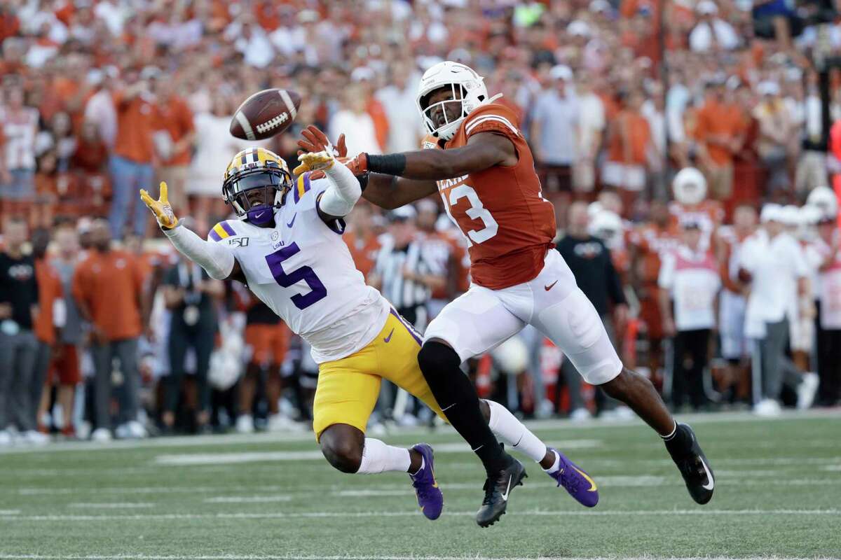 LSU cornerback Kary Vincent Jr. (5) breaks up a pass intended for Texas wide receiver Brennan Eagles (13) during the first half of an NCAA college football game Saturday, Sept. 7, 2019, in Austin, Texas. (AP Photo/Eric Gay)