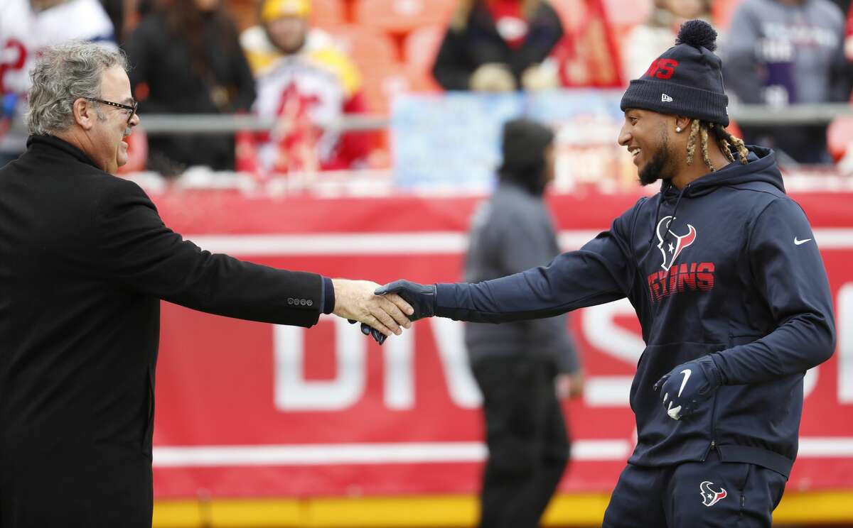 Houston Texans chairman and CEO Cal McNair shakes hands with Texans strong safety Justin Reid before an AFC divisional playoff game at Arrowhead Stadium on Sunday, Jan. 12, 2020, in Kansas City, Mo.
