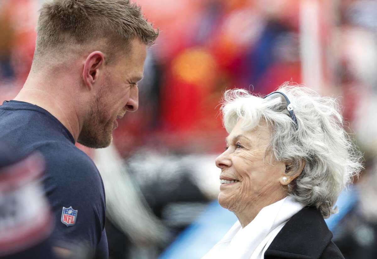 Houston Texans defensive end J.J. Watt, let, talks to Texans co-founder Janice McNair before an AFC divisional playoff game at Arrowhead Stadium on Sunday, Jan. 12, 2020, in Kansas City, Mo.