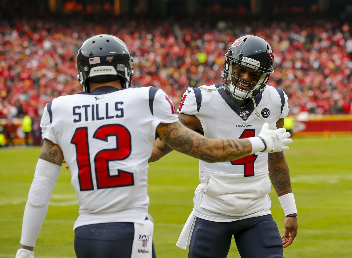 Houston Texans quarterback Deshaun Watson (4) and Houston Texans wide receiver Kenny Stills (12) celebrate during the first quarter of an AFC divisional playoff game at Arrowhead Stadium on Sunday, Jan. 12, 2020, in Kansas City, Mo.
