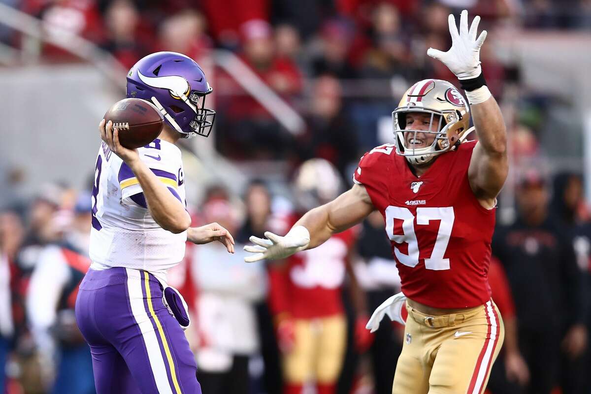 SANTA CLARA, CALIFORNIA - JANUARY 11: Kirk Cousins #8 of the Minnesota Vikings is pressured by Nick Bosa #97 of the San Francisco 49ers during the second half of the NFC Divisional Round Playoff game at Levi's Stadium on January 11, 2020 in Santa Clara, California. (Photo by Ezra Shaw/Getty Images)