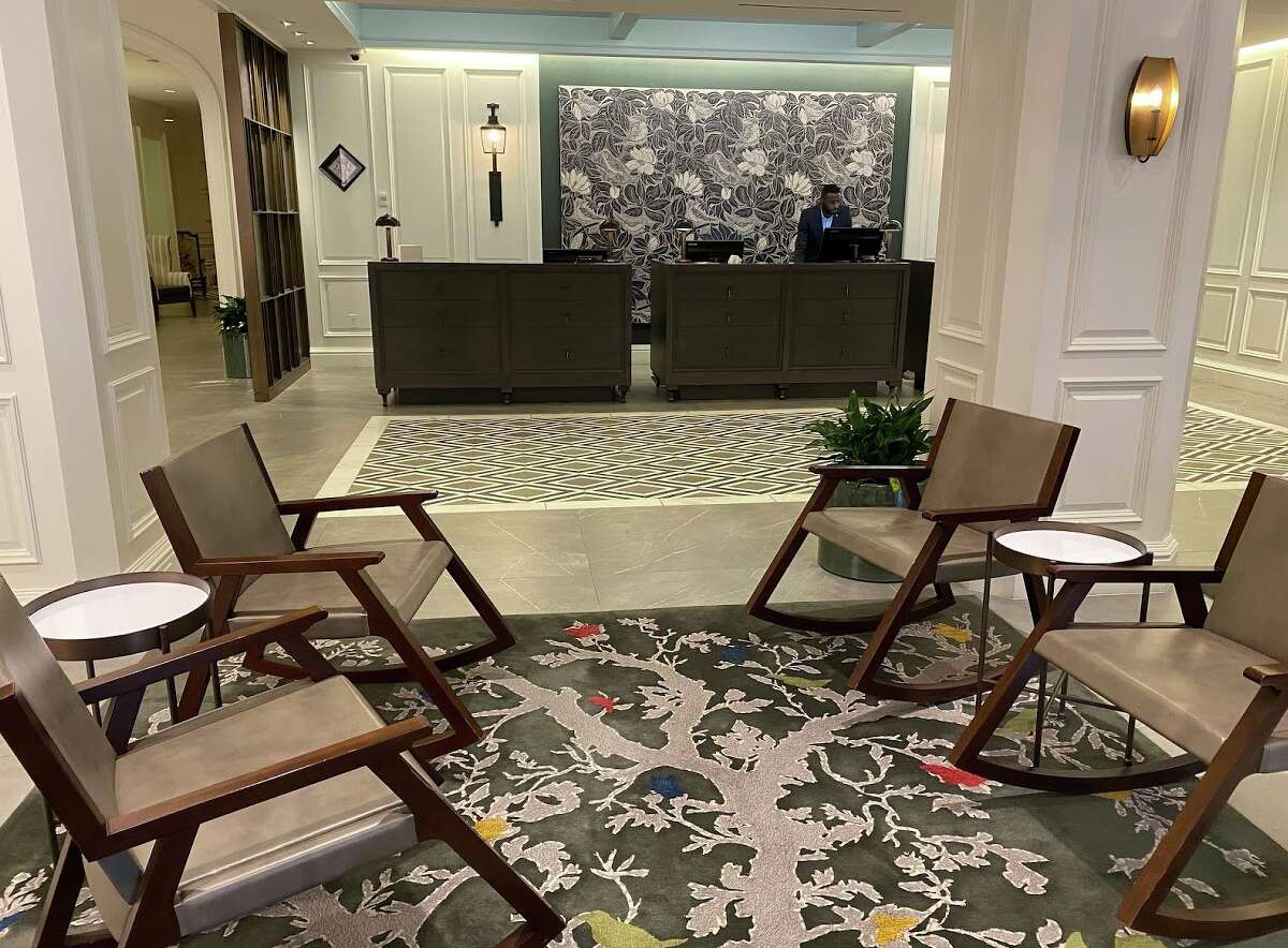 Modern rocking chairs add a "front porch" feel to the contemporary lobby at the Whitley Hotel in Atlanta.