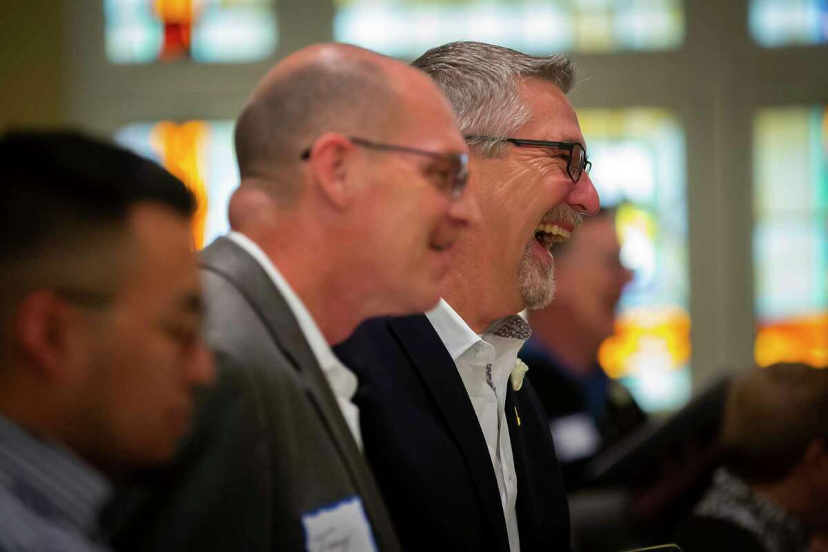 Dr. Jack Nemecek laughs as he sings during a Blessing of Unions service at Bering Church. He and his husband, Tony Morrison, participated in the service as an act of “civil disobedience” against the Methodist Church’s stance on same-sex marriage and participating clergy.
